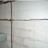 Severe foundation damage from a long crack in a bucking wall of a Happy home.