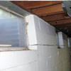 A foundation showing severe inward buckling along the windows in a Canadian home.