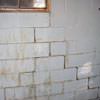 A cracked foundation wall near a window in a Clarendon home
