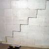 A diagonal stair step crack along the foundation wall of a Dimmitt home