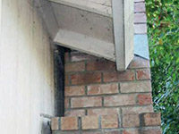 A chimney leaning away from the home on a Hale Center foundation