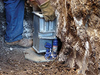 Securing a foundation footing bracket for a foundation repair system in Childress.
