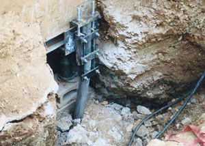 a bent, failed foundation push pier installed in Abilene.