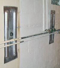 A foundation wall anchor system used to repair a basement wall in Hale Center