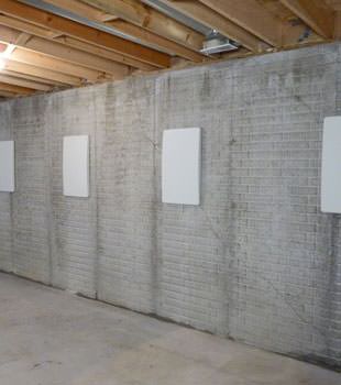Wall anchor covers covering a foundation wall repair system in Odessa, Childress, Perryton, Happy, Canadian