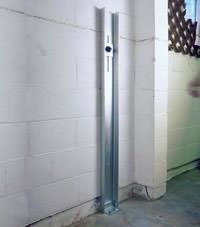 A failing foundation wall repaired with a foundation wall channel anchor system in a Pampa home.