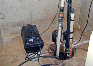 Pedestal sump pump system installed in a home in Happy