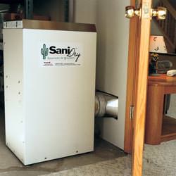A basement dehumidifier with an ENERGY STAR® rating ducting dry air into a finished area of the basement  in Cactus