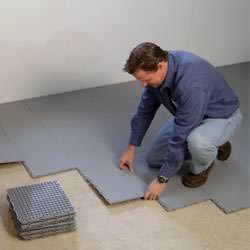 basement subfloor tiles being installed by a contractor in Wellington