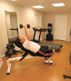 a basement gym and workout room with a wood laminate flooring, installed in Pampa, TX